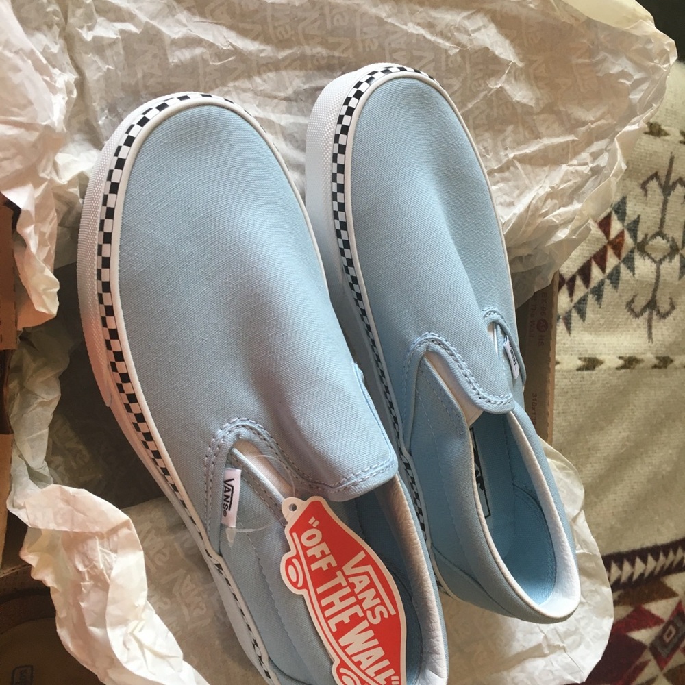 Vans Sky Blue Slip-On Sneakers with checkered border.